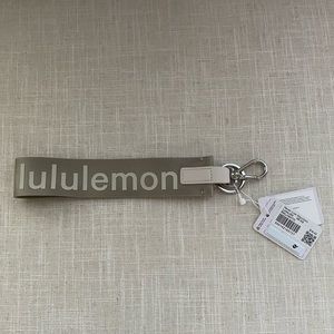 Lululemon Never Lost Keychain in white opal/raw linen